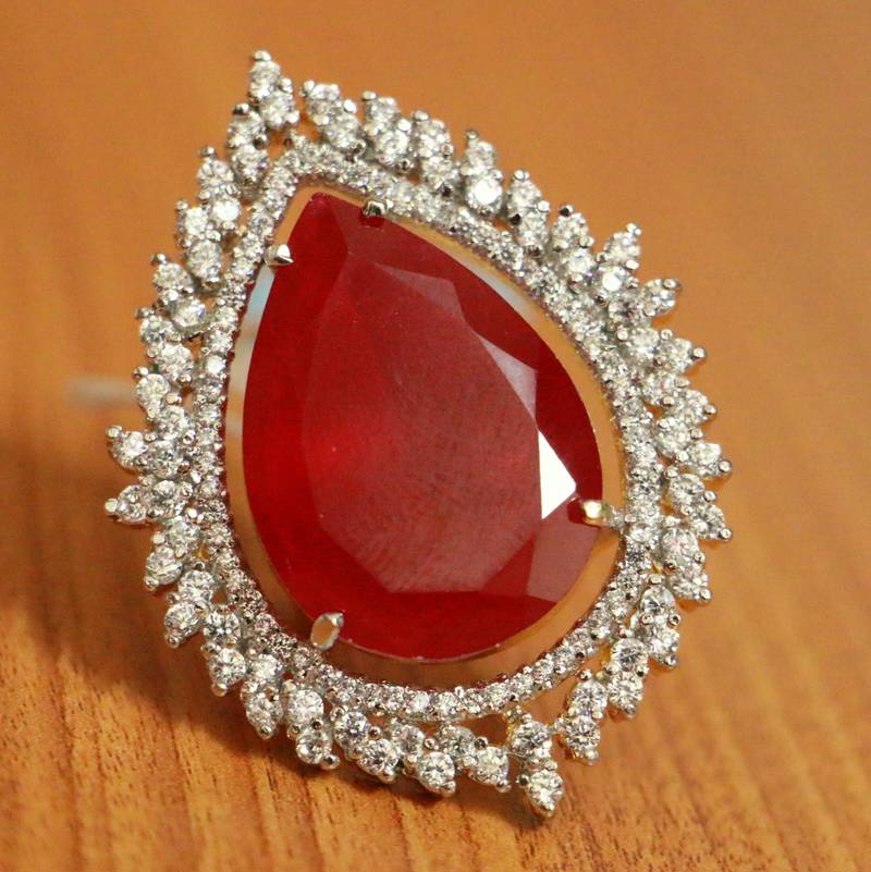 Halo Style Ruby and Diamond Ring in White Gold | KLENOTA